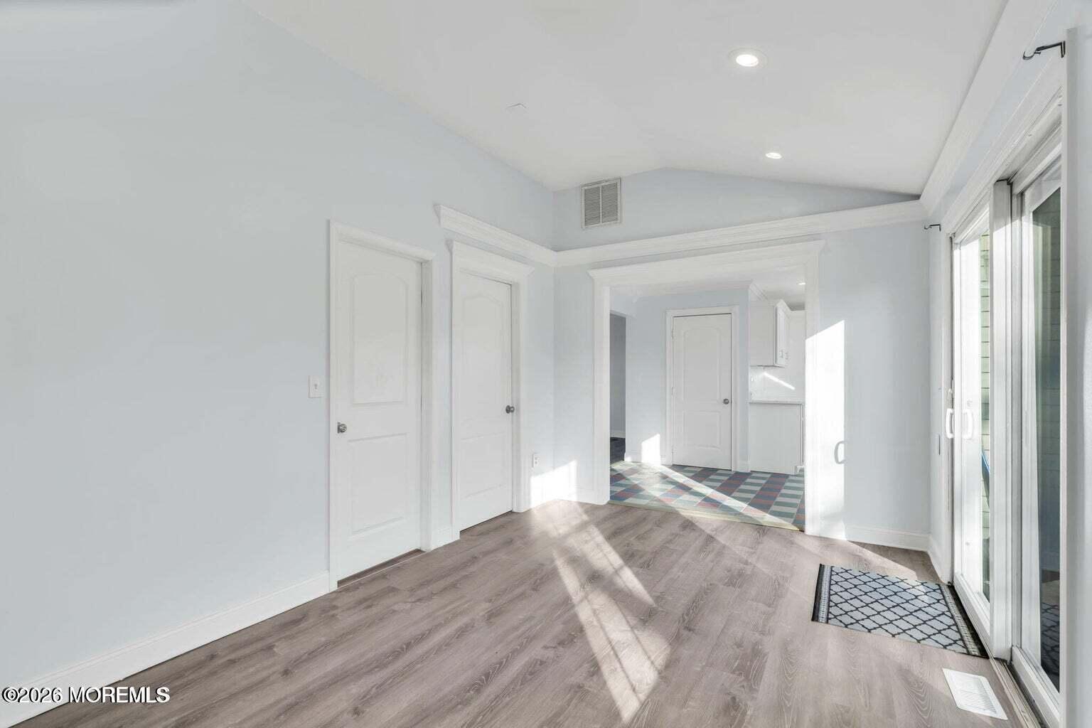 905 Harrison Road Toms River, NJ 08753 - Photo 12 of 34 a view of a room with wooden floor and bathroom