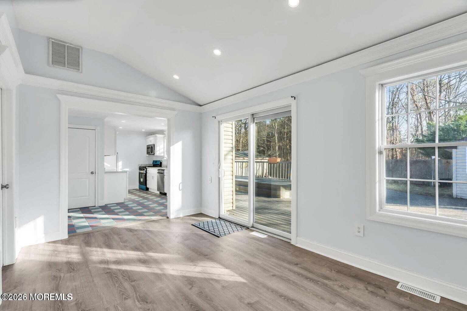 905 Harrison Road Toms River, NJ 08753 - Photo 13 of 34 a view of a room with wooden floor and windows