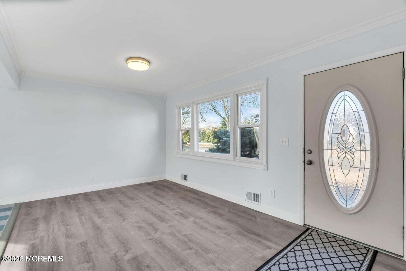 905 Harrison Road Toms River, NJ 08753 - Photo 17 of 34 an empty room with a window and a mirror