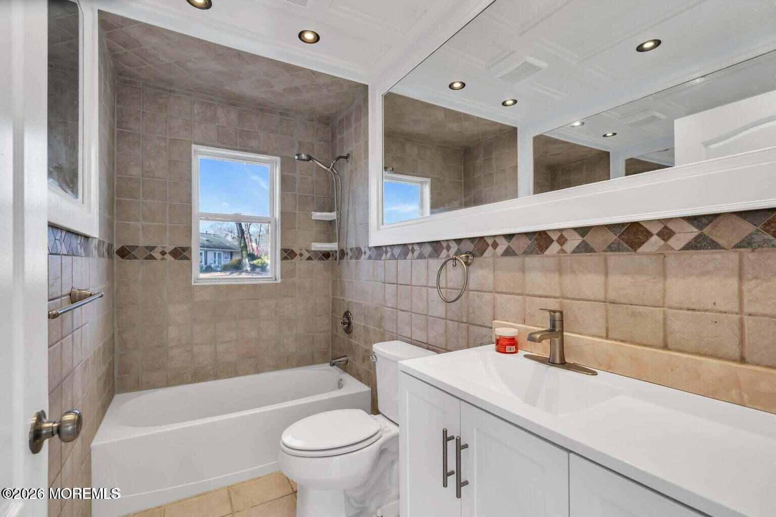 905 Harrison Road Toms River, NJ 08753 - Photo 20 of 34 a bathroom with a sink toilet and shower