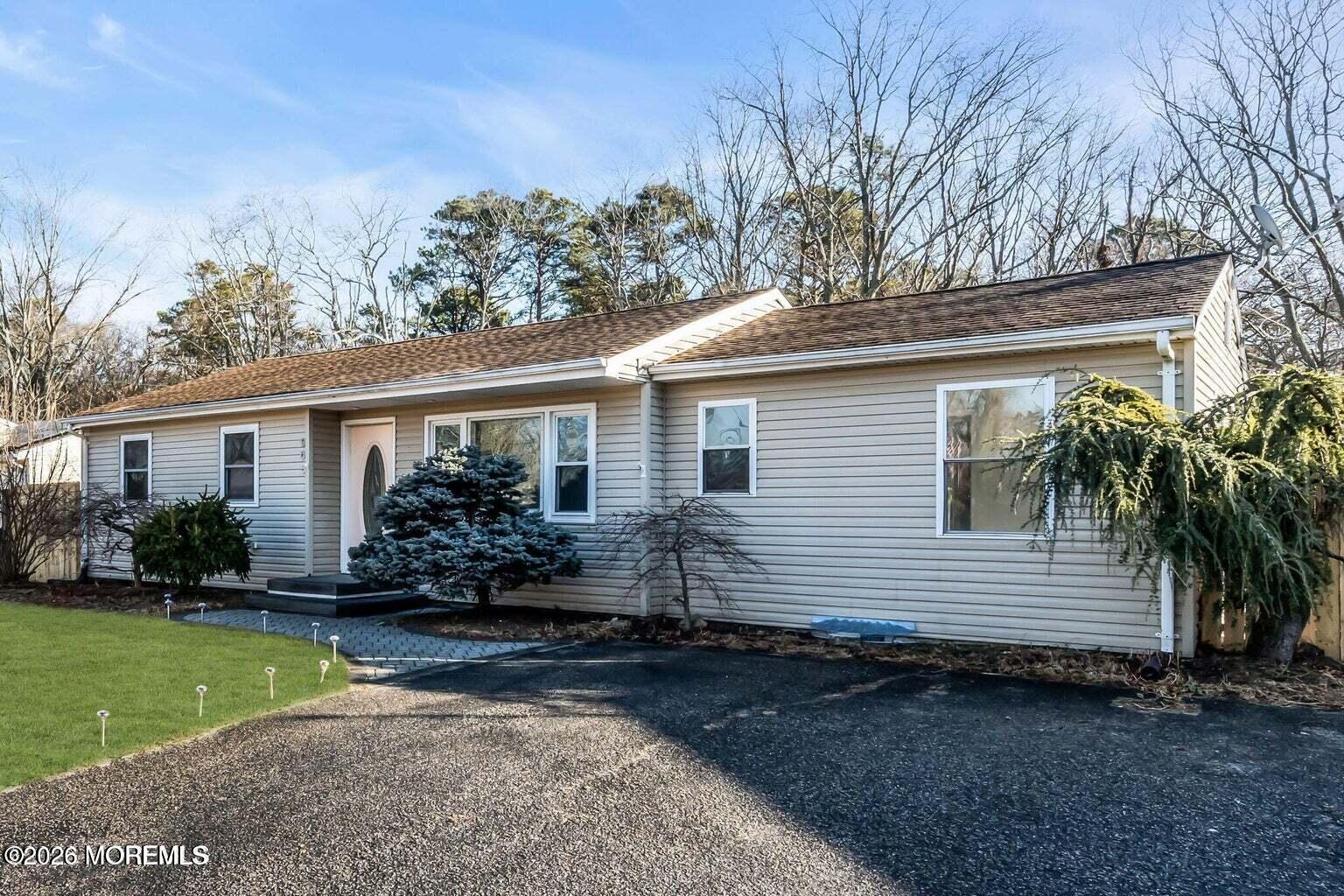 905 Harrison Road Toms River, NJ 08753 - Photo 3 of 34 a front view of a house with garden