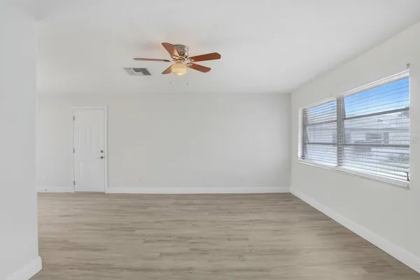 a view of an empty room with a window