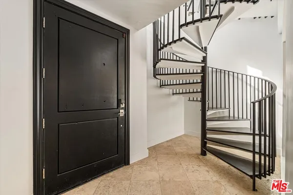 a view of entryway with wooden floor