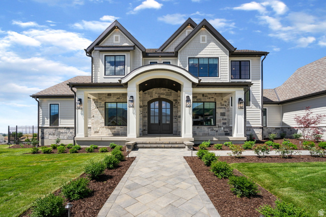 115 East Hidden Ridge Lane, Unit 42 Mapleton, UT 84664 - Photo 100 of 103 Distinguished architectural design featuring a prominent arched entry, stone and siding facade, and multiple gables