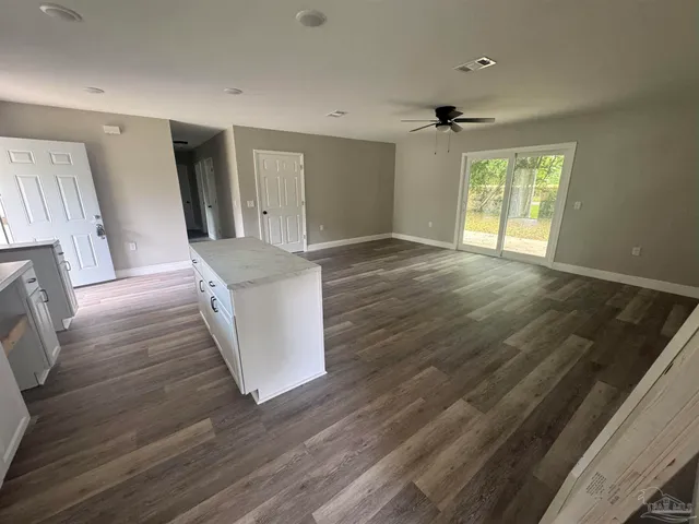 a view of a kitchen cabinets and wooden floor