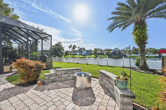 a view of a house with swimming pool and sitting area