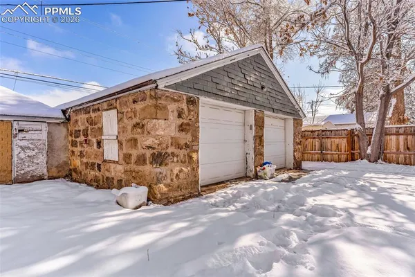 a view of a house with a snow in the yard