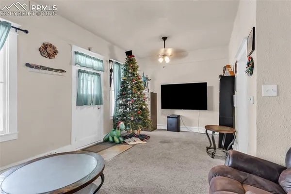 a living room with furniture and a flat screen tv