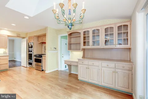 a view of a kitchen with a sink and cabinets