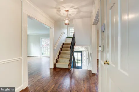 wooden floor in an empty room with a gallery