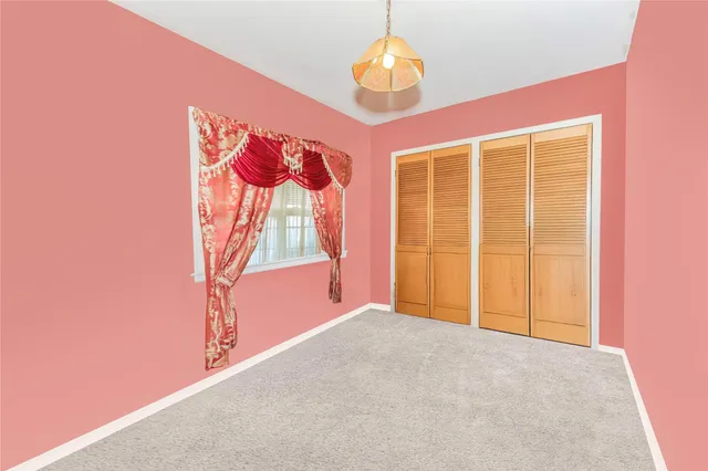 view of an empty room with a window