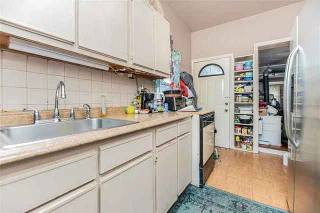 a kitchen with cabinets and a sink