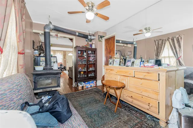 a room with furniture a chandelier and a window