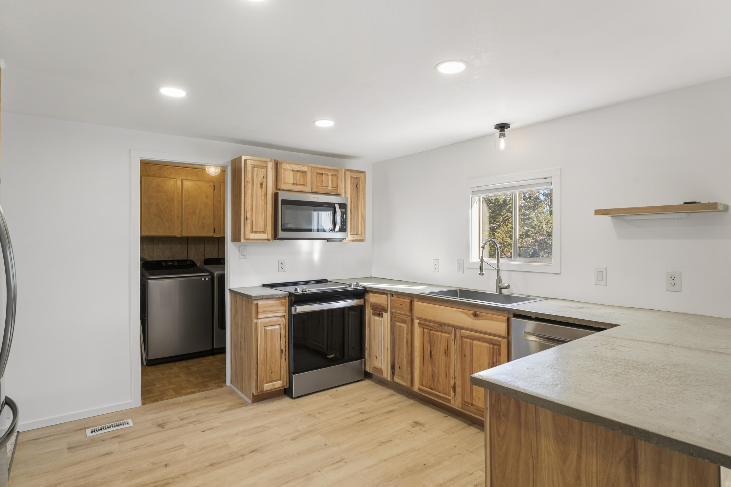9318 Southwest Panorama Road Terrebonne, OR 97760 - Photo 12 of 45 a kitchen with a sink stove and refrigerator