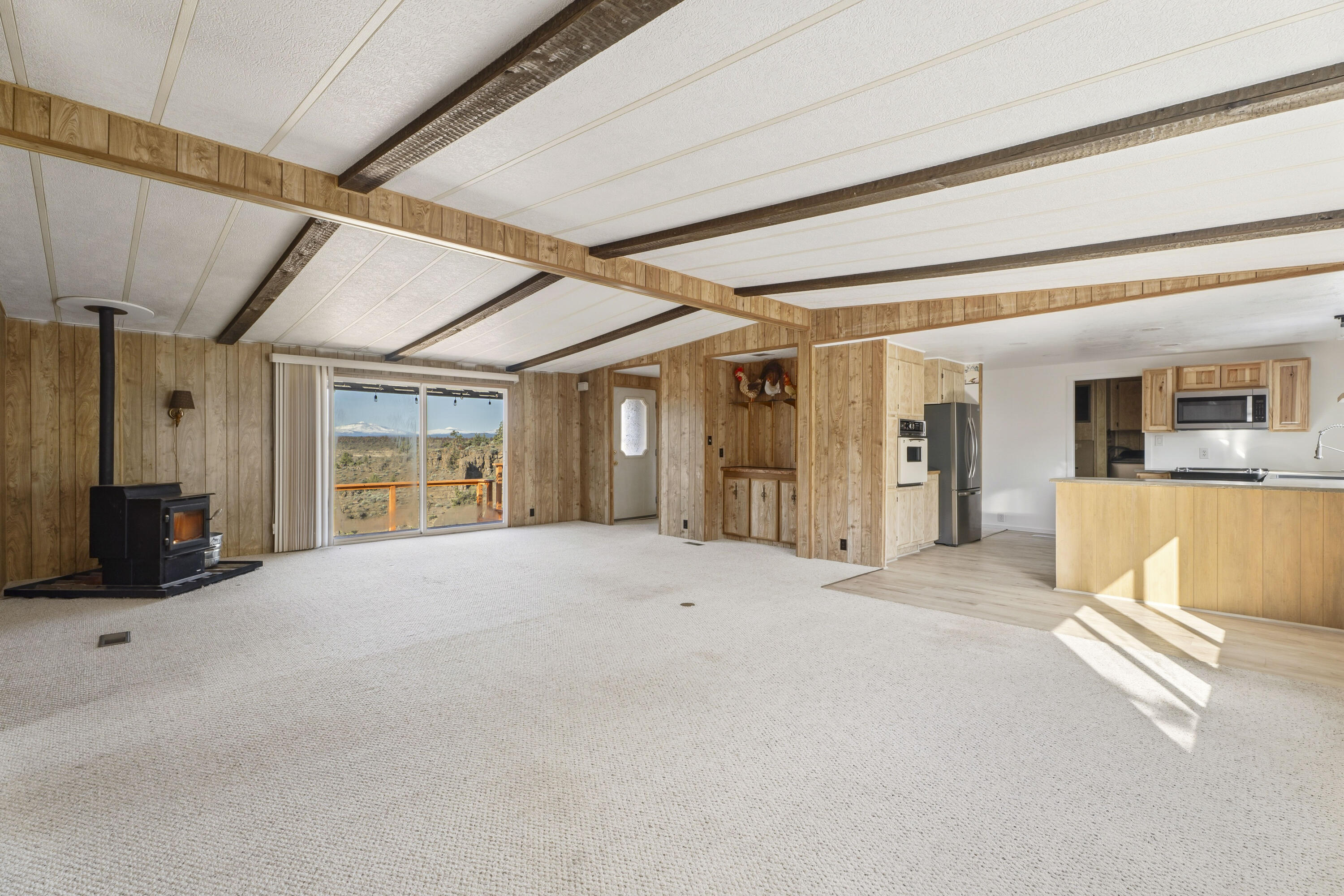 9318 Southwest Panorama Road Terrebonne, OR 97760 - Photo 8 of 45 a view of an empty room with wooden floor and a window