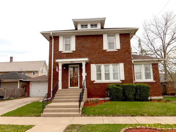 a front view of a house with yard