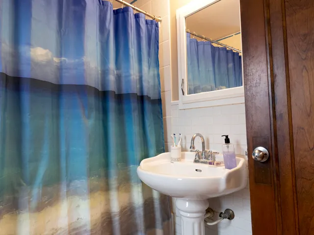 a bathroom with a sink and mirror