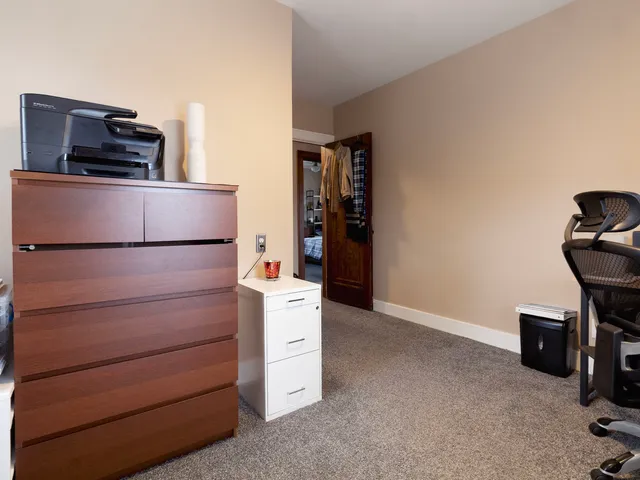 a kitchen with a refrigerator and a stove