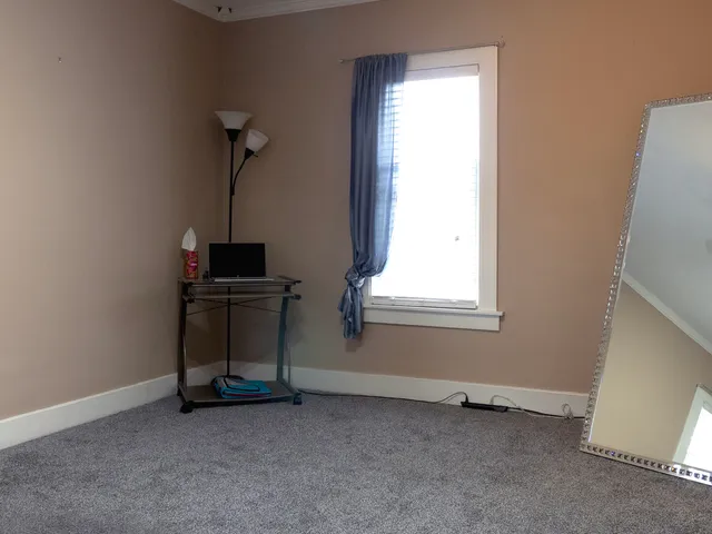 a view of empty room with windows