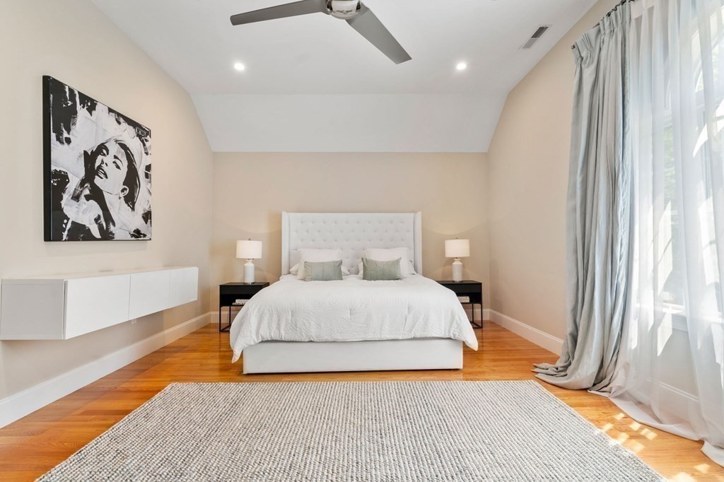 116 School Street Lexington, MA 02421 - Photo 13 of 33 a bedroom with a bed and a large window