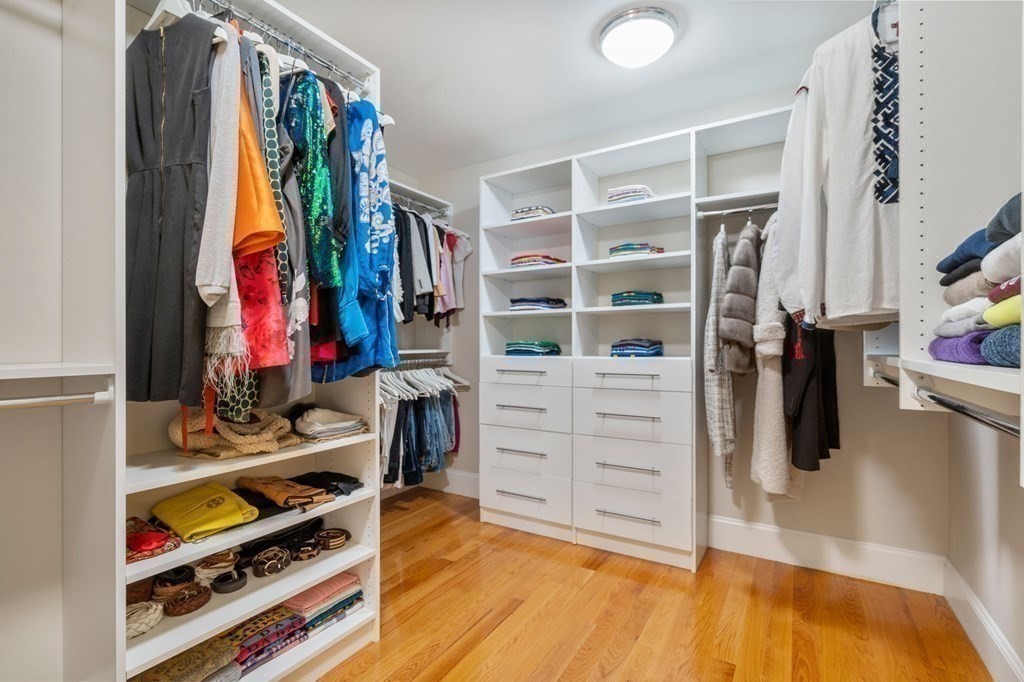 116 School Street Lexington, MA 02421 - Photo 16 of 33 a view of walk in closet with clothes and shoes