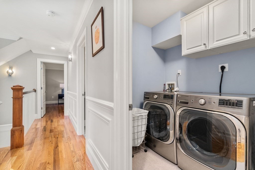 116 School Street Lexington, MA 02421 - Photo 23 of 33 a view of a hallway with washer and dryer