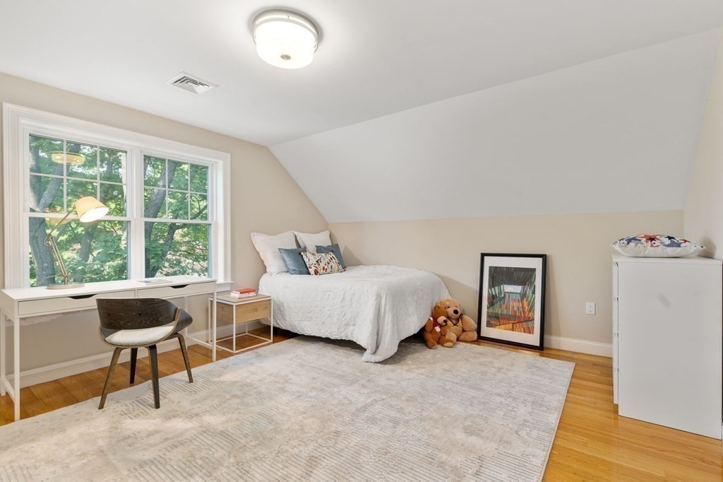 116 School Street Lexington, MA 02421 - Photo 26 of 33 a spacious bedroom with a bed and a large window