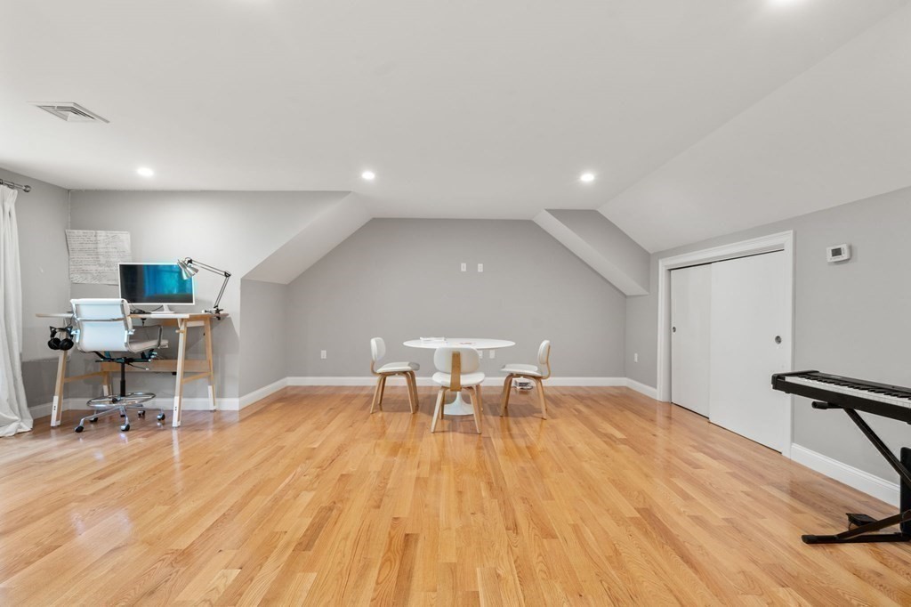 116 School Street Lexington, MA 02421 - Photo 27 of 33 a view of a work space with furniture and wooden floor