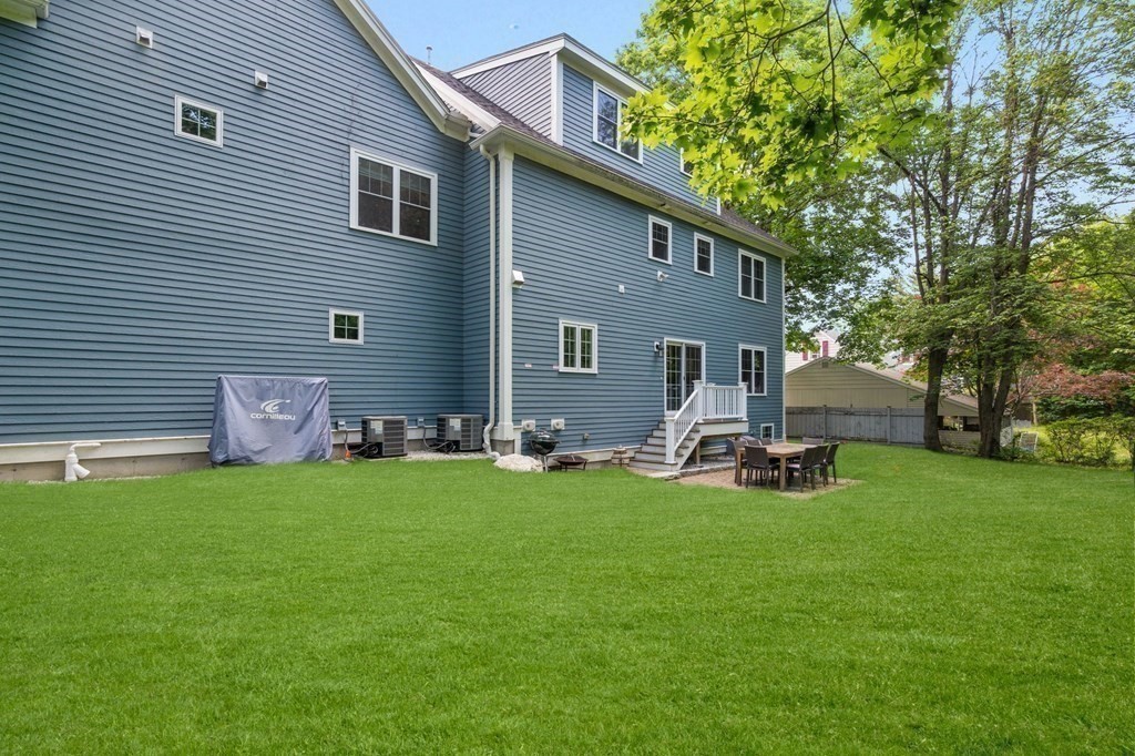 116 School Street Lexington, MA 02421 - Photo 28 of 33 a view of a house with backyard and porch