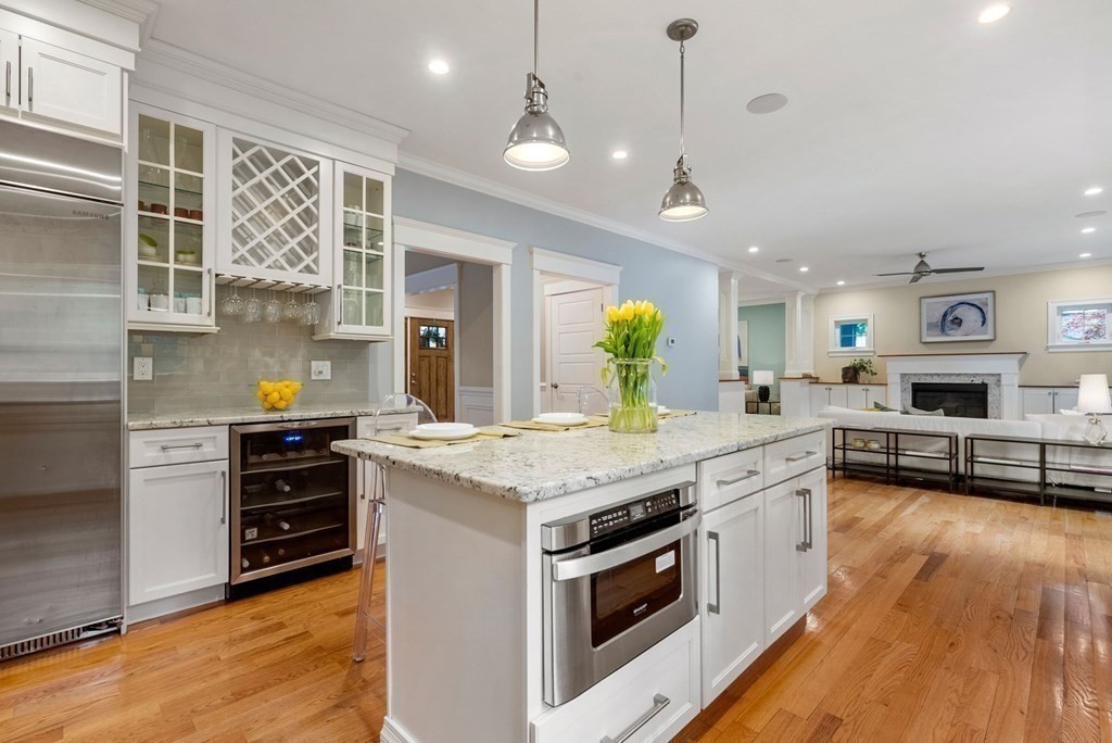 116 School Street Lexington, MA 02421 - Photo 9 of 33 a kitchen with a stove and a wooden floor