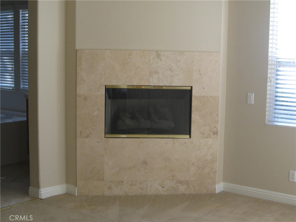 19 Coriander Irvine, CA 92603 - Photo 11 of 40 a close view of a fireplace in a room