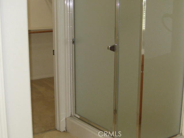 19 Coriander Irvine, CA 92603 - Photo 22 of 40 a bathroom with a glass shower door