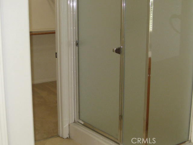 19 Coriander Irvine, CA 92603 - Photo 26 of 40 a bathroom with a glass shower door