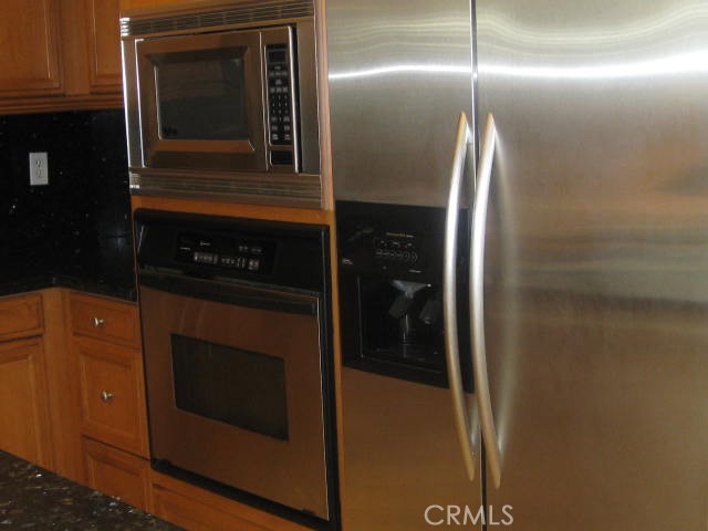 19 Coriander Irvine, CA 92603 - Photo 6 of 40 a kitchen with a refrigerator and a sink