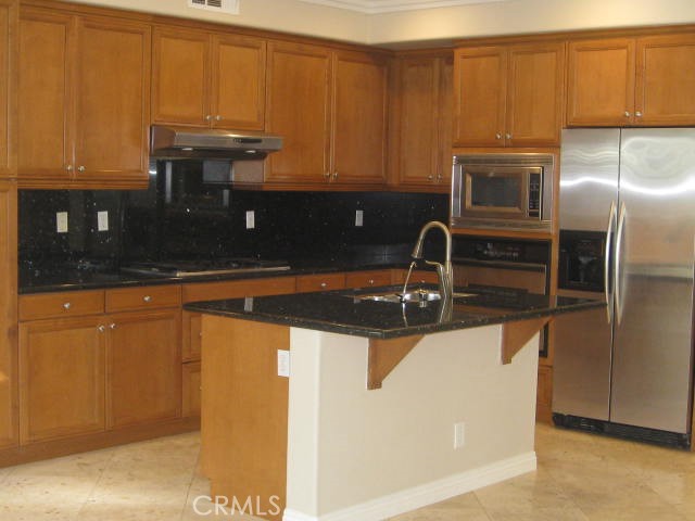 19 Coriander Irvine, CA 92603 - Photo 8 of 40 a close view of a sink and dishwasher