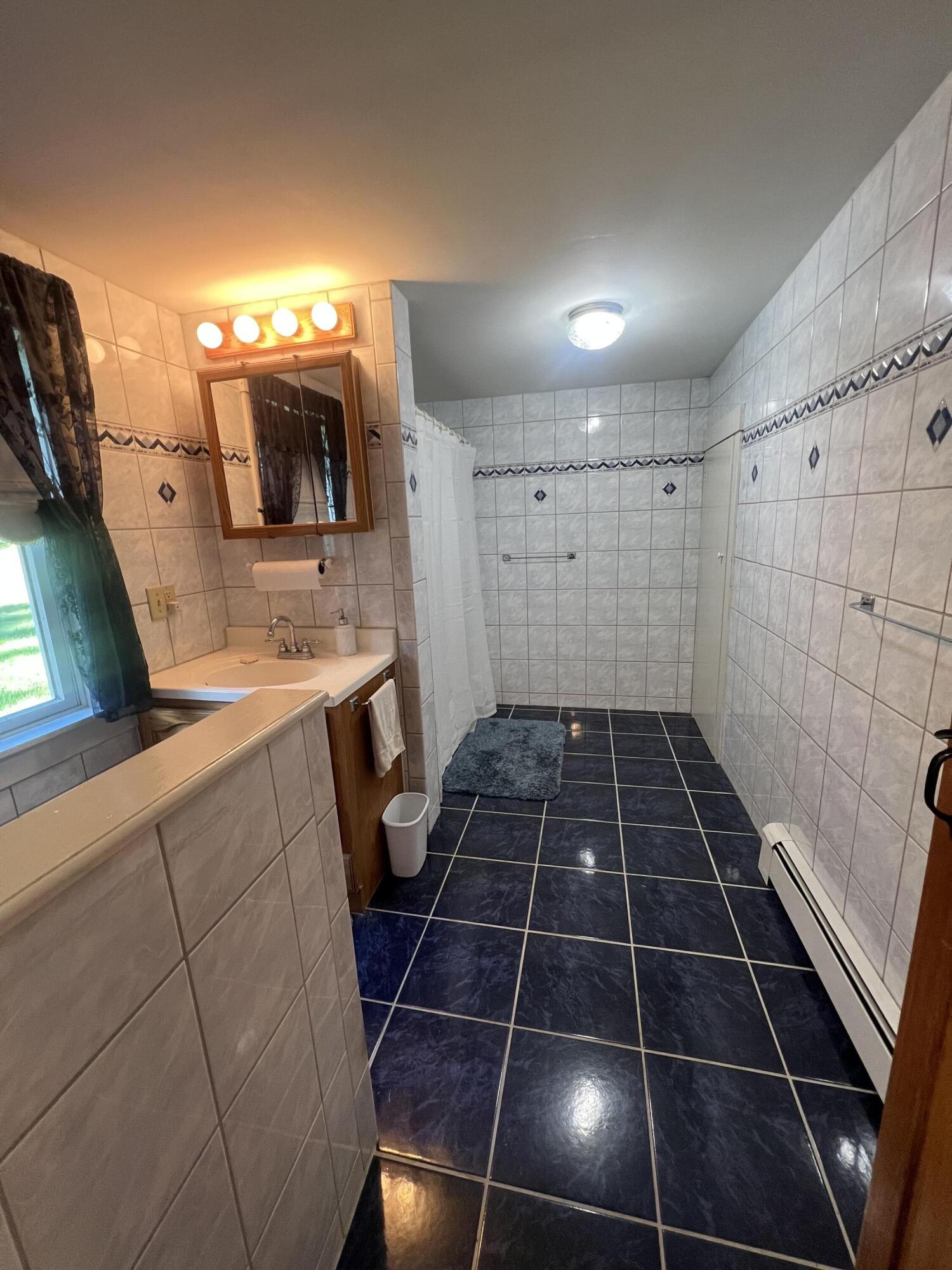425 Phillips Road Weld, ME 04285 - Photo 11 of 56 Bath Main Floor