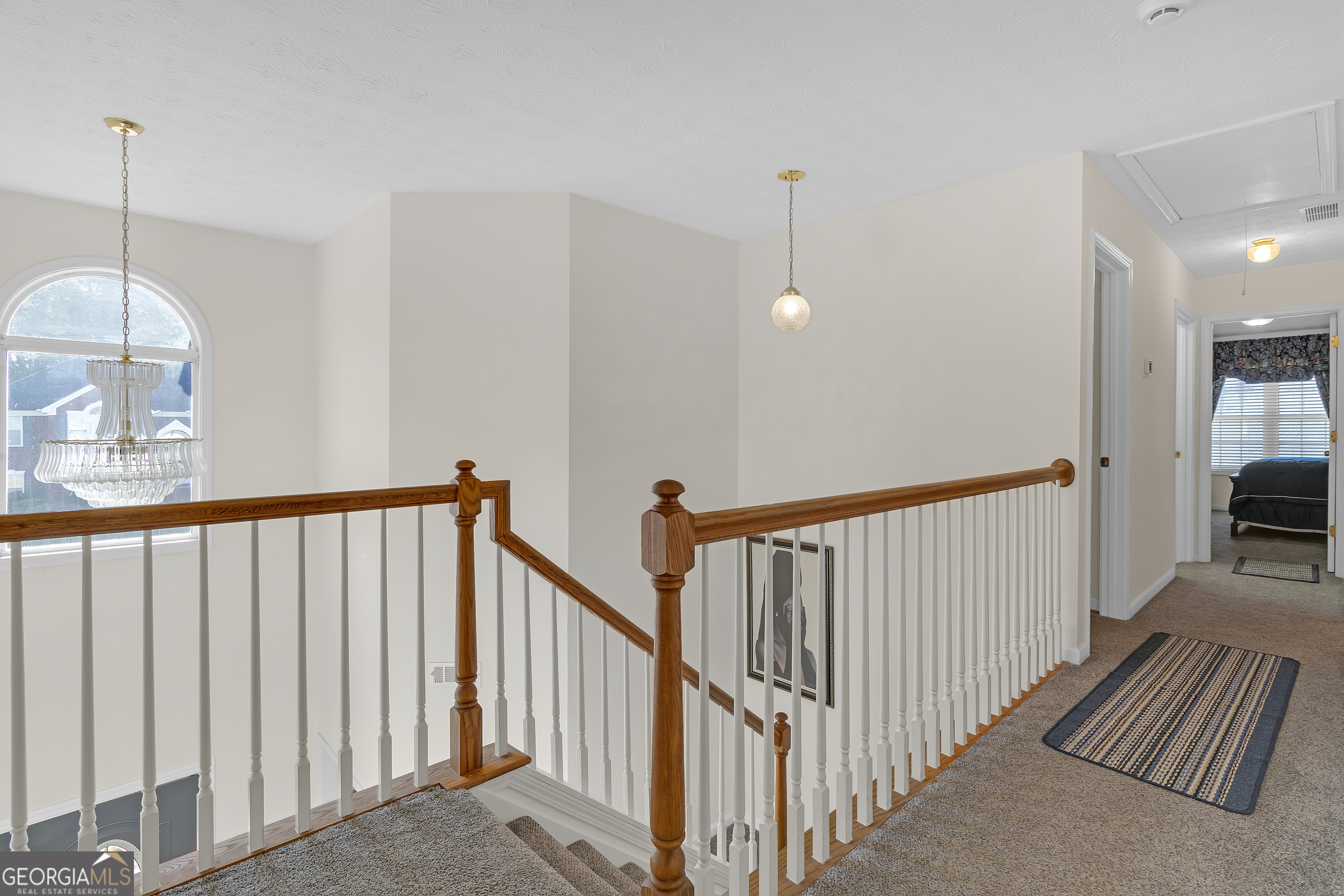 2215 Brandon Lane Southwest Conyers, GA 30094 - Photo 18 of 31 a view of a hallway with wooden floor and stairs