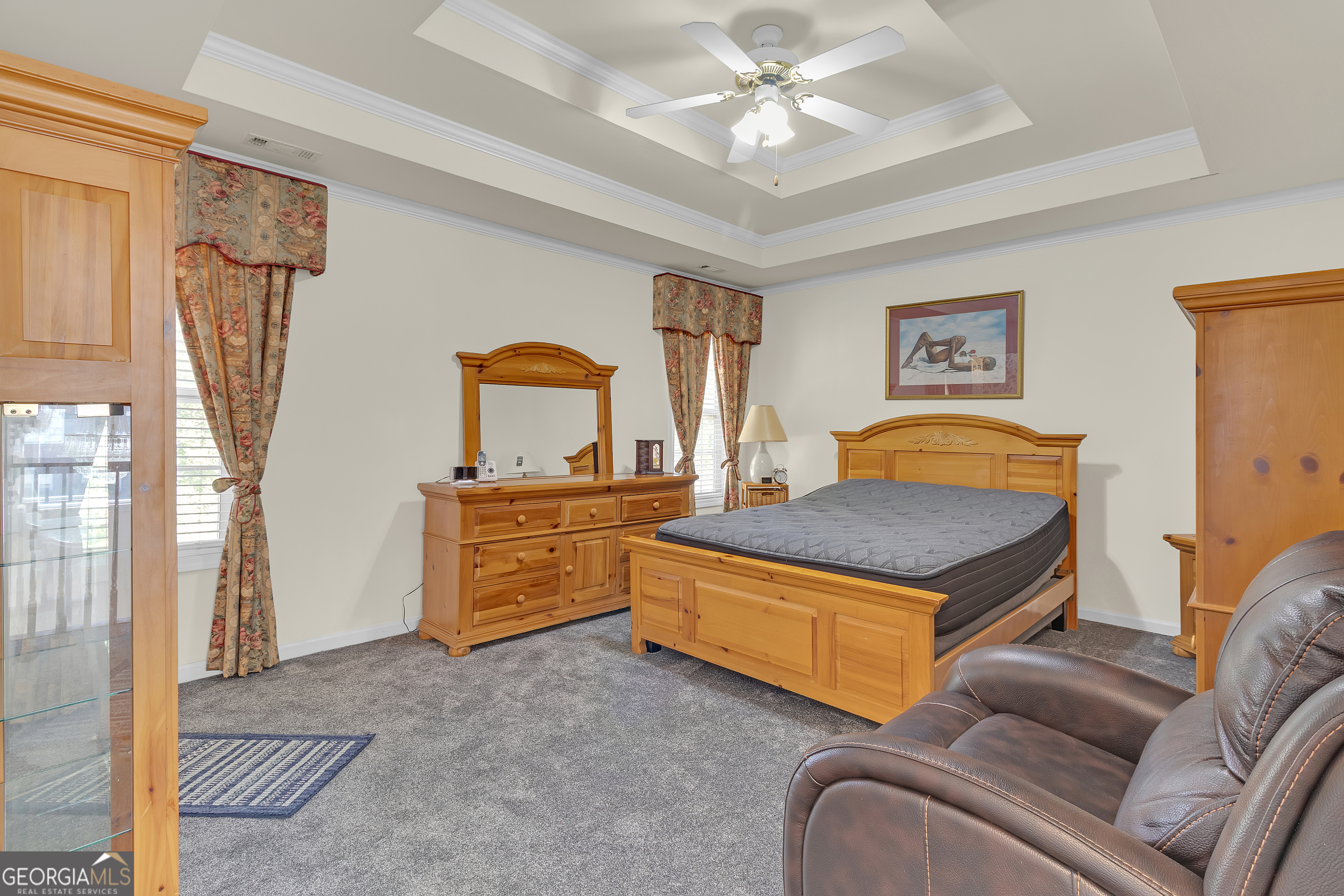 2215 Brandon Lane Southwest Conyers, GA 30094 - Photo 20 of 31 a living room with furniture and a chandelier