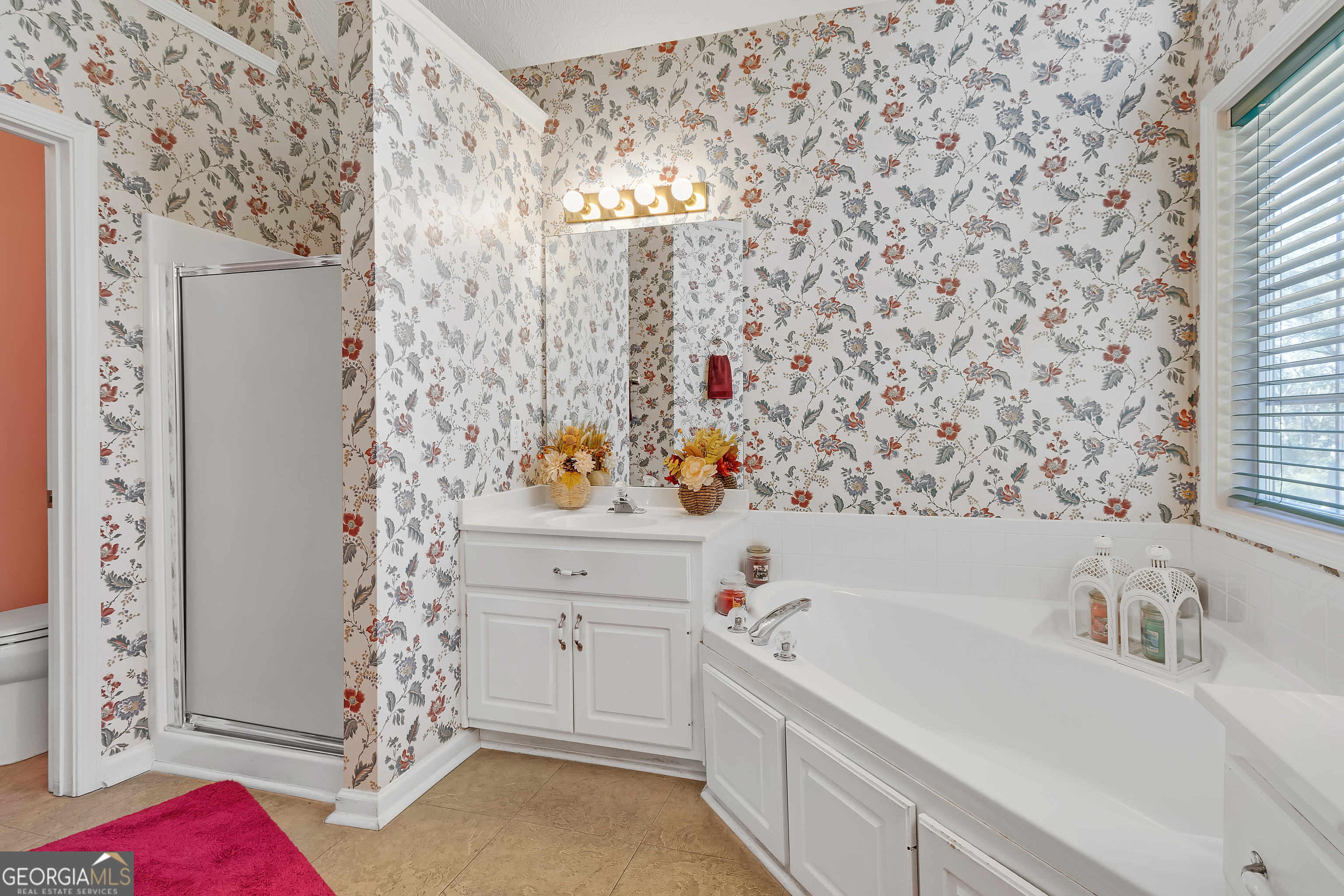 2215 Brandon Lane Southwest Conyers, GA 30094 - Photo 22 of 31 a bathroom with a sink and a bathtub