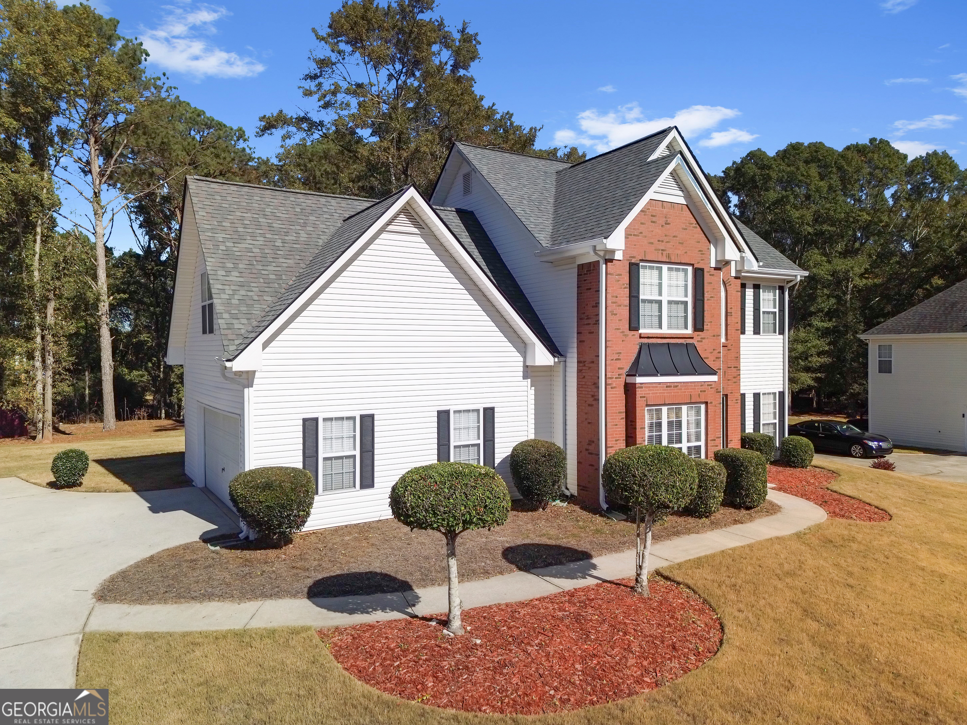 2215 Brandon Lane Southwest Conyers, GA 30094 - Photo 7 of 31 a front view of a house with yard and green space