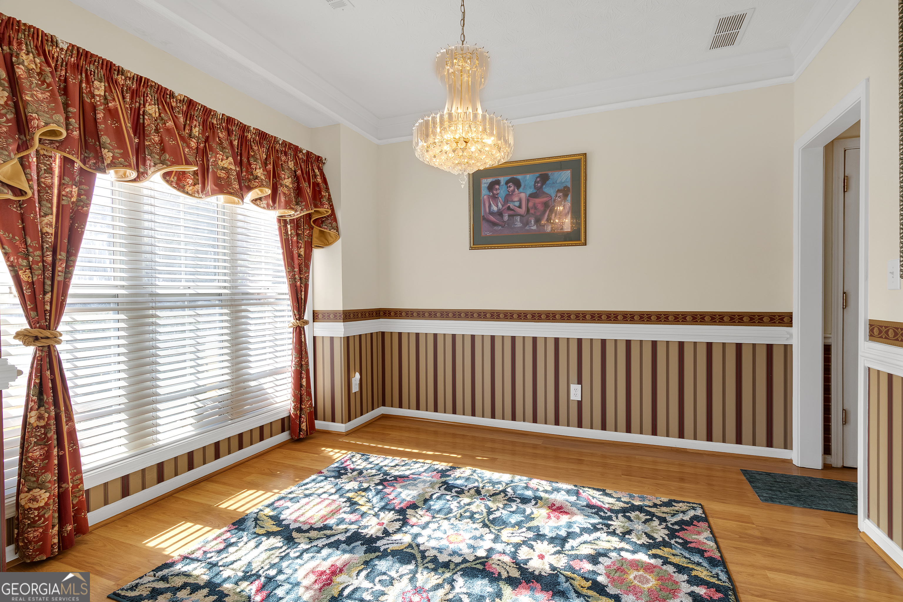 2215 Brandon Lane Southwest Conyers, GA 30094 - Photo 9 of 31 a view of a bedroom with wooden floor & a rug