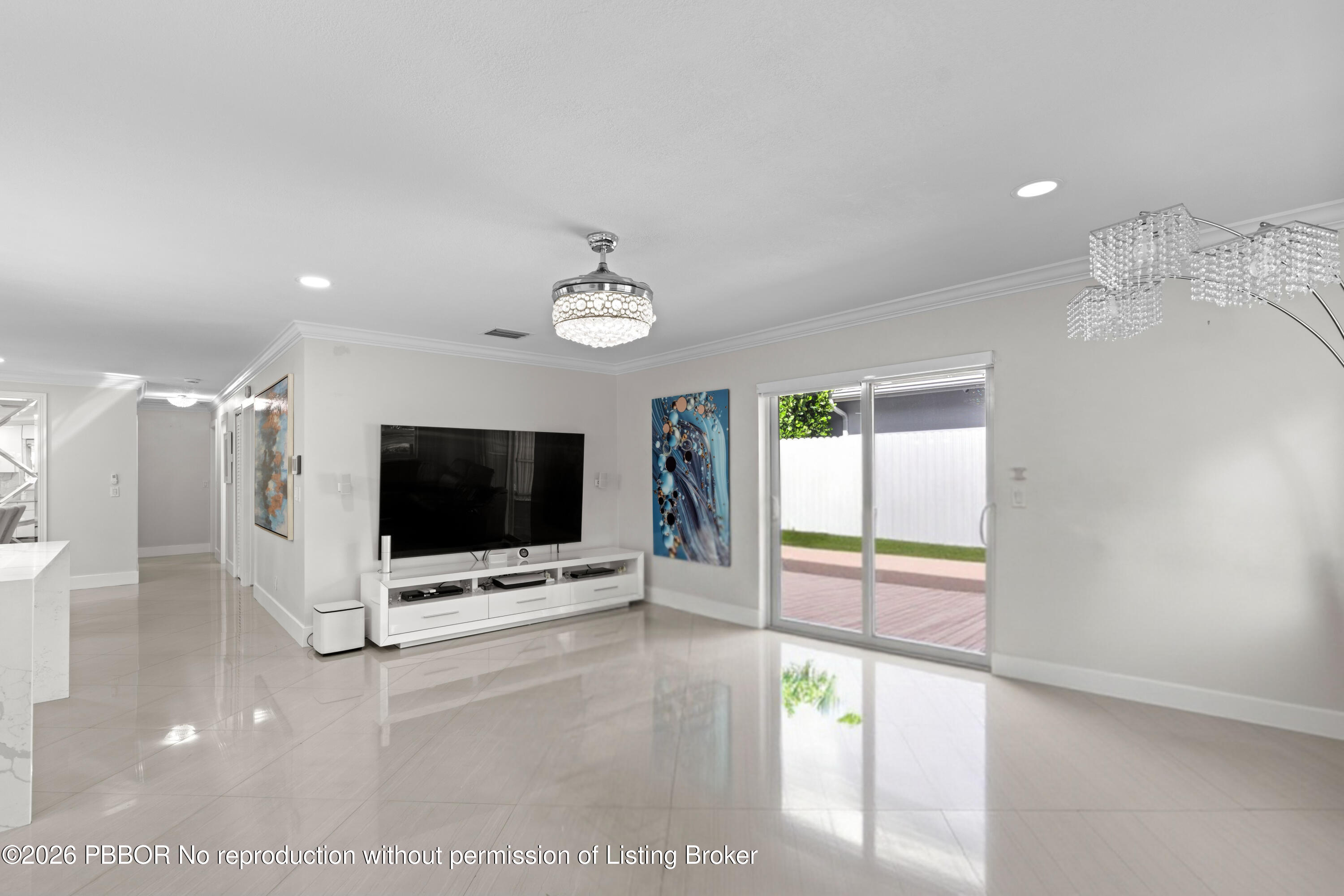 747 Avon Road West Palm Beach, FL 33401 - Photo 6 of 29 a view of a livingroom with wooden floor and a flat screen tv