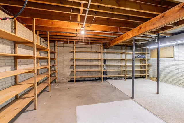 a view of an empty room with storage