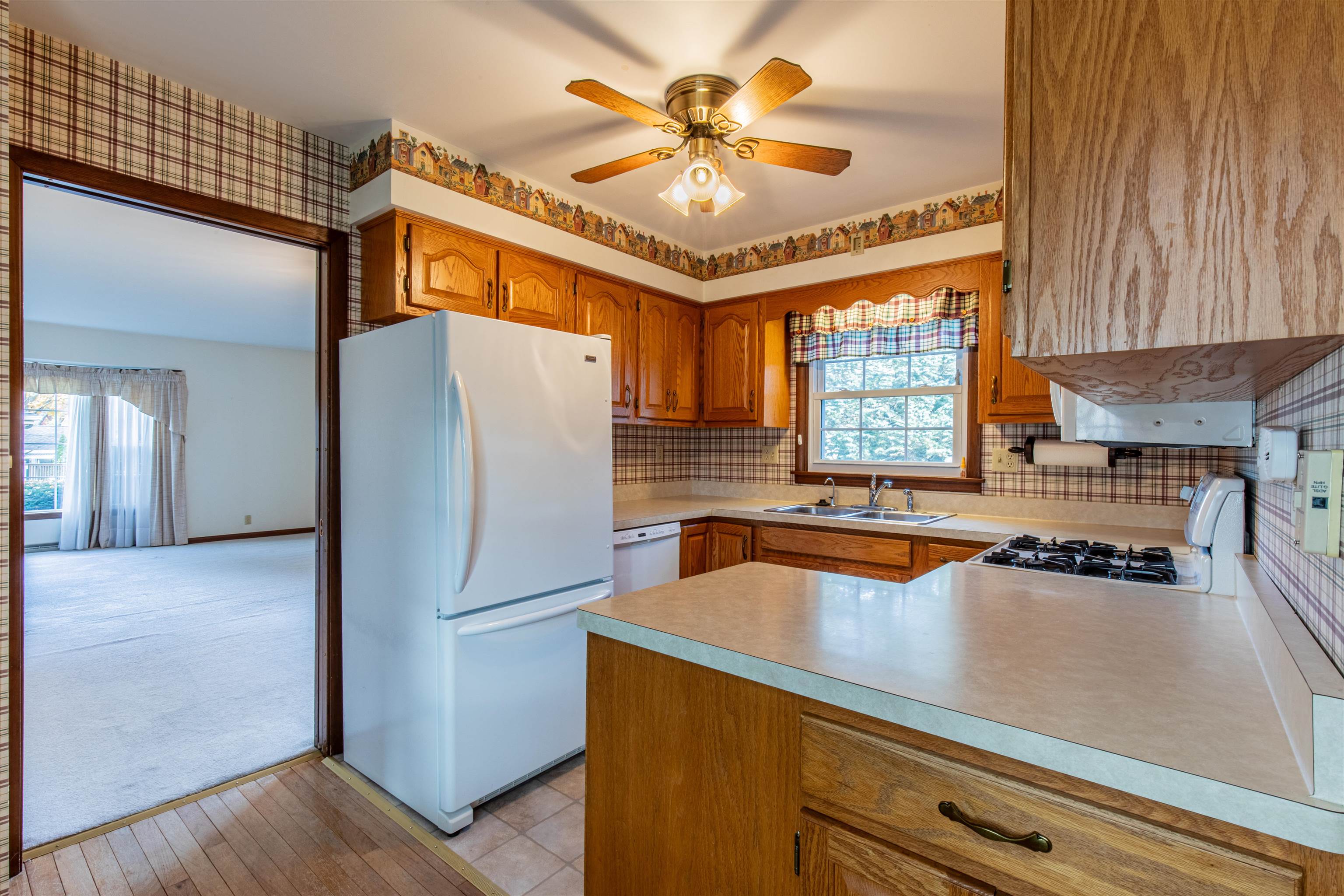 1403 Timothee Lane Mendota, IL 61342 - Photo 27 of 29 a kitchen with a refrigerator a sink and cabinets