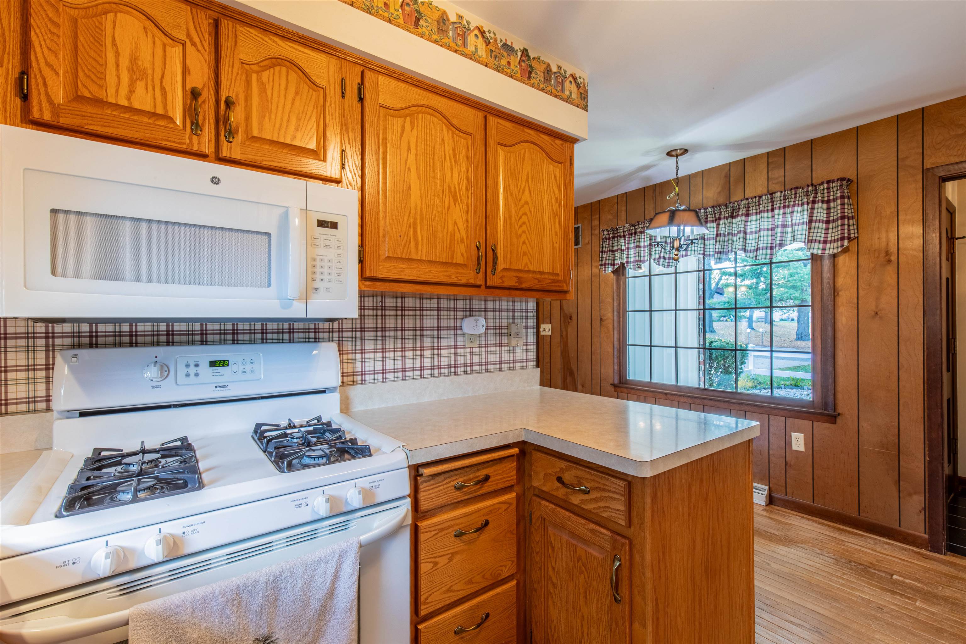 1403 Timothee Lane Mendota, IL 61342 - Photo 28 of 29 a kitchen with granite countertop cabinets and a stove top oven