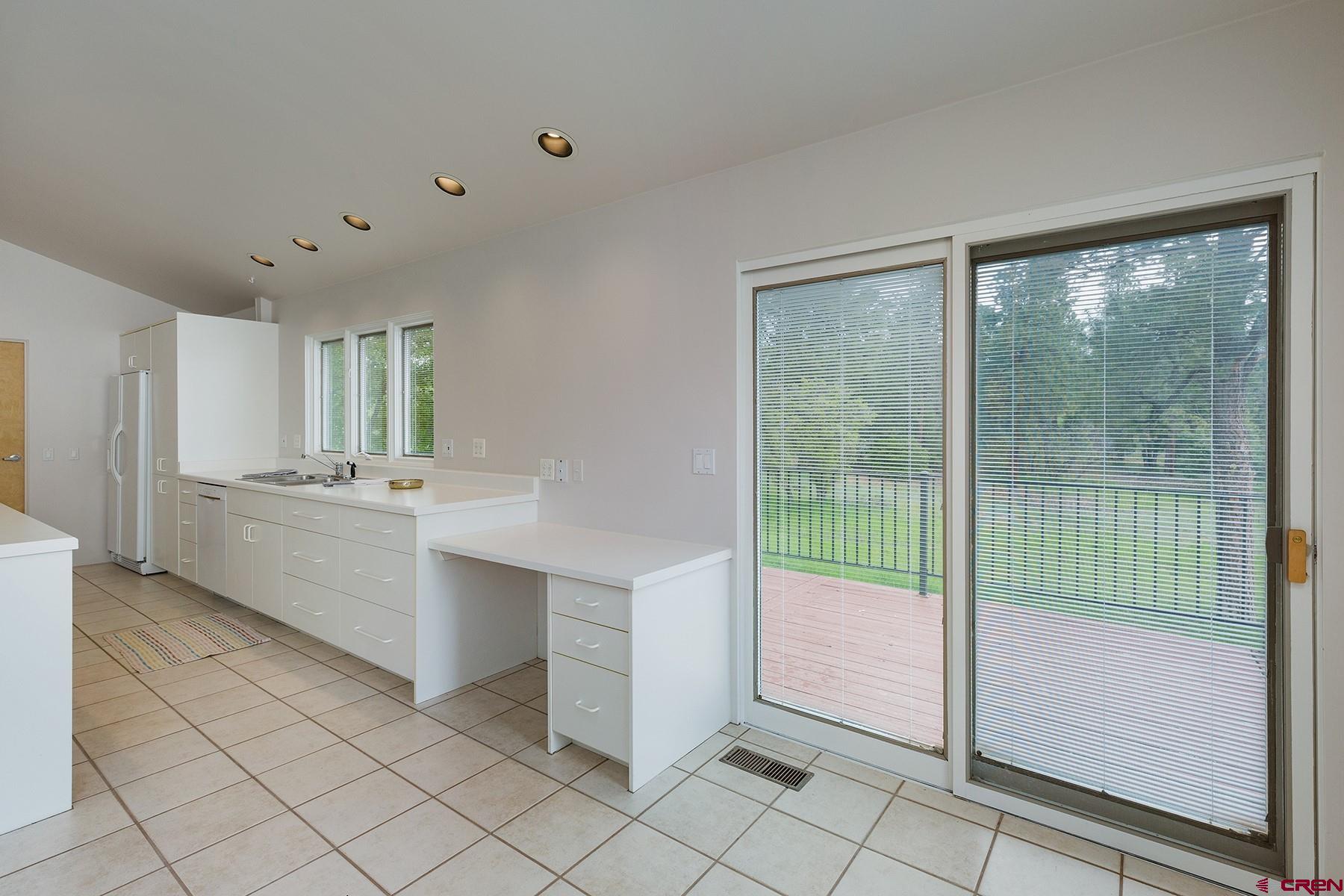 85 Blue Ridge Hesperus, CO 81326 - Photo 13 of 33 a bathroom with a double vanity sink and mirror