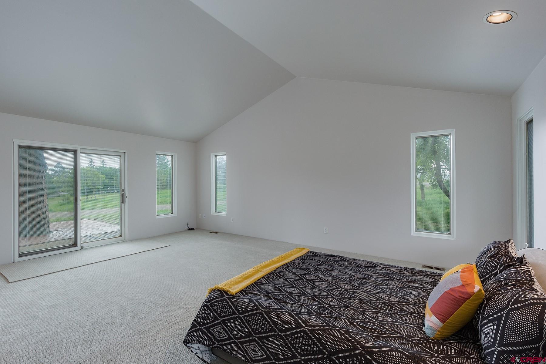 85 Blue Ridge Hesperus, CO 81326 - Photo 14 of 33 a bed sitting in a bedroom next to a window