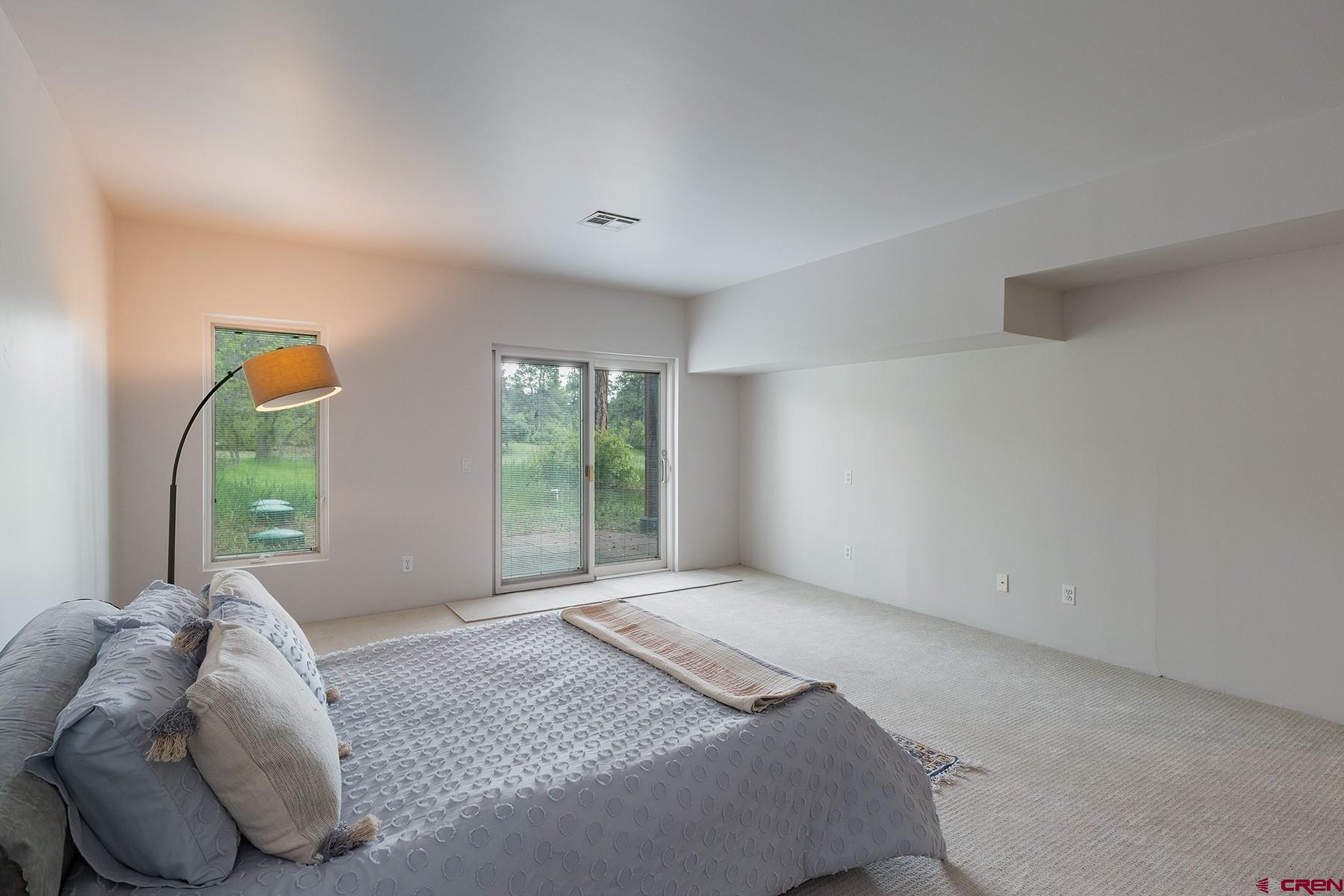 85 Blue Ridge Hesperus, CO 81326 - Photo 21 of 33 a bed room with a bed and a large window