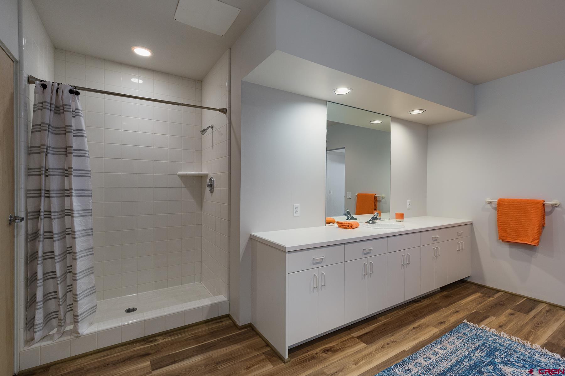 85 Blue Ridge Hesperus, CO 81326 - Photo 22 of 33 a bathroom with a shower sink and mirror