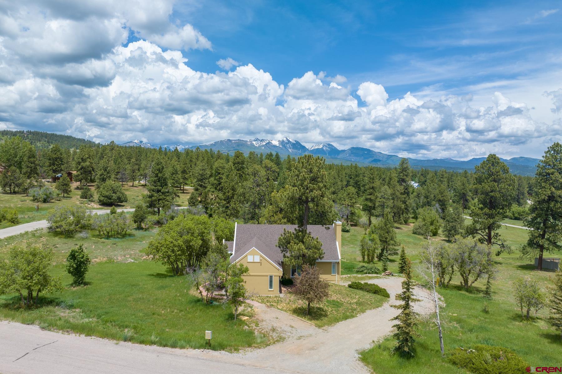 85 Blue Ridge Hesperus, CO 81326 - Photo 4 of 33 a view of a city with flower plants and wooden fence